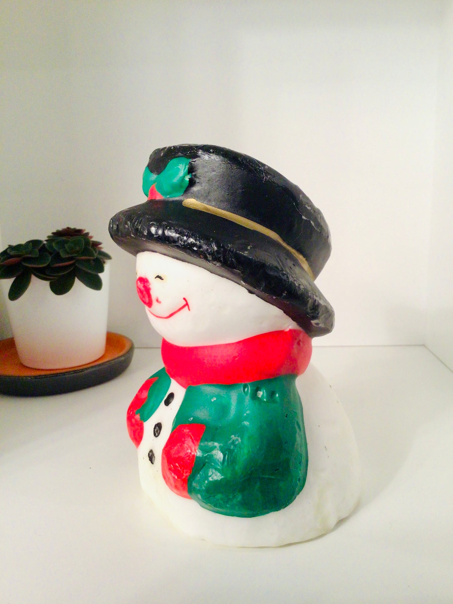 Vintage kaars in de vorm van een sneeuwman