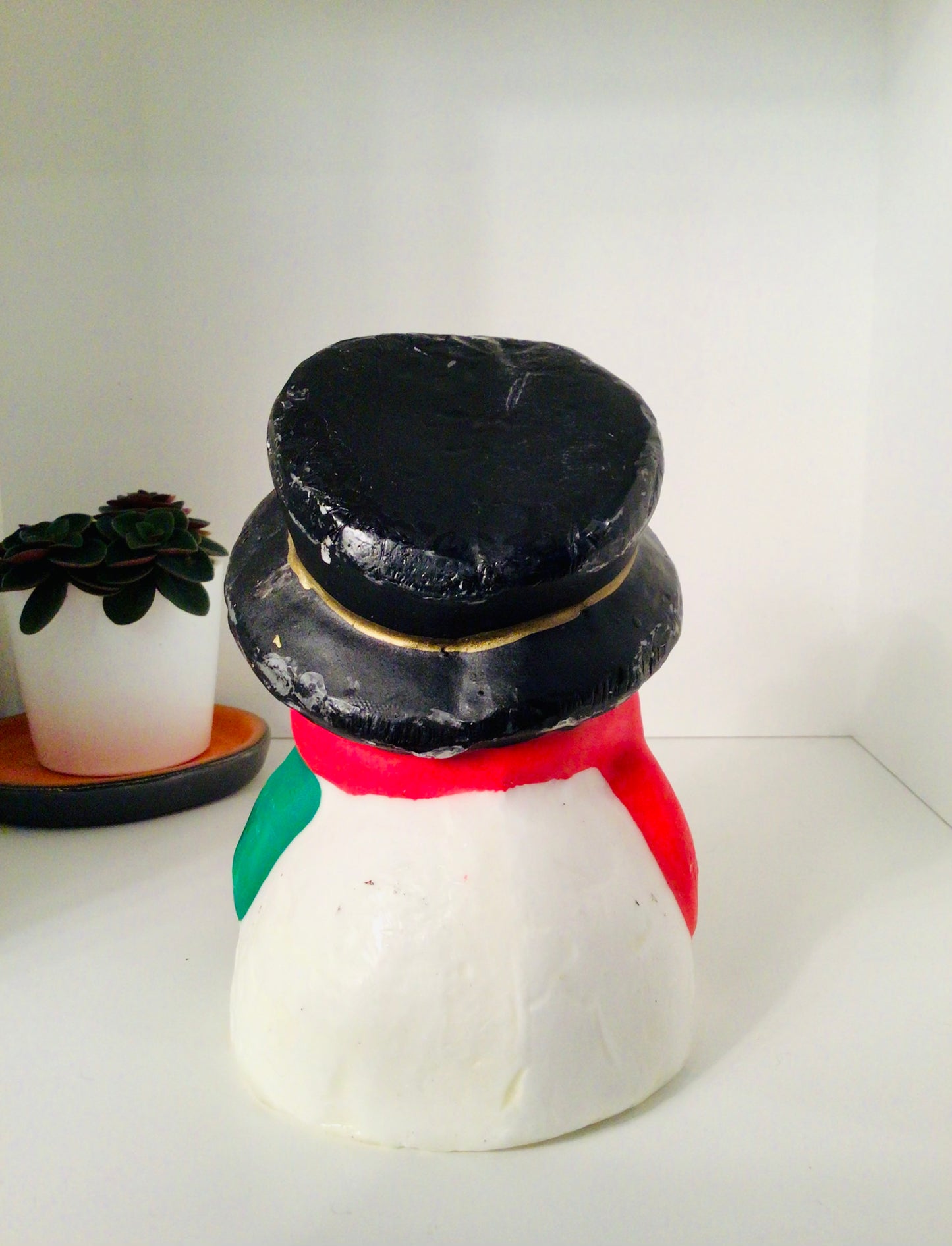 Vintage kaars in de vorm van een sneeuwman